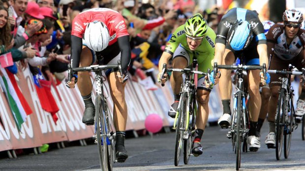 German Marcel Kittel (left, Giant Shimano), crosses the finish line in Dublin to win the third stage of the Giro d'Italia on Sunday.
