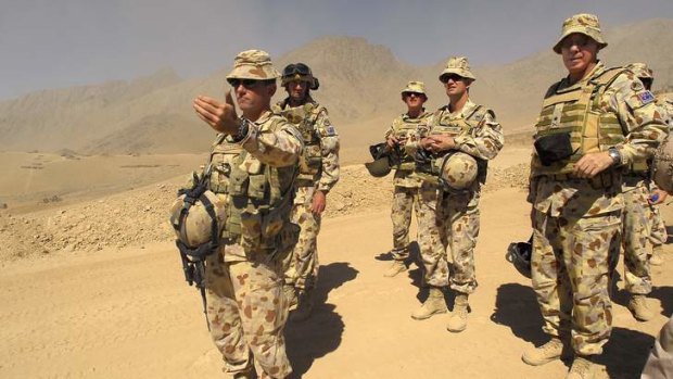 Lieutenant Colonel Stuart Yeaman (front) with colleagues in former Taliban territory, Oruzgan Province, Afghanistan.