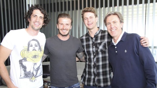 Fox FM's Andy Lee (left), Glenn Robbins (right) and ''Cacklin''' Jack Post with David Beckham.