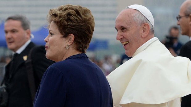 Pope Francis is welcomed by Brazilian President Dilma Rousseff upon landing at Rio de Janeiro's Galeao-Antonio Carlos Jobim International Airport