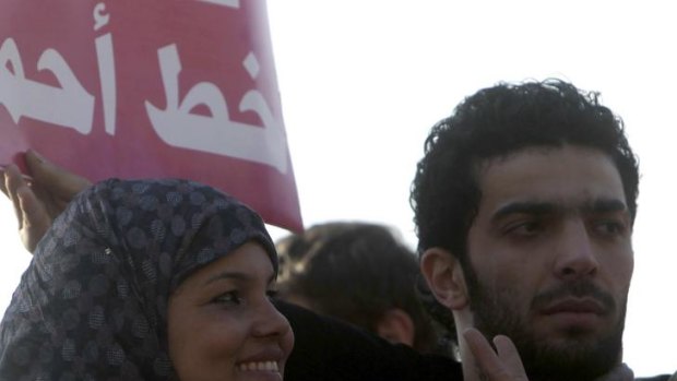 Samira Ibrahim, left,  at a protest against military council violations and virginity tests against females at Tahrir Square in Cairo.