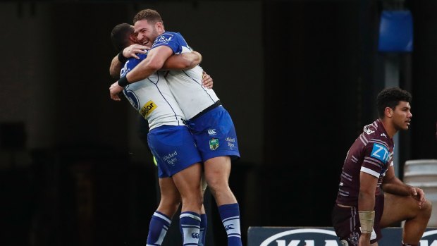 Bounce back: Brenko Lee, right, and Marcelo Montoya hug after a try.