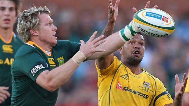Focused ... South African captain Jean de Villiers and Kurtley Beale of the Wallabies.