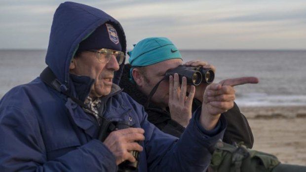 Watch the birdie: John Lees, left, and Garry Bagnell observe a shorelark in Great Yarmouth, England.