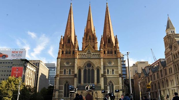 A large media contingent sets up outside the cathedral.