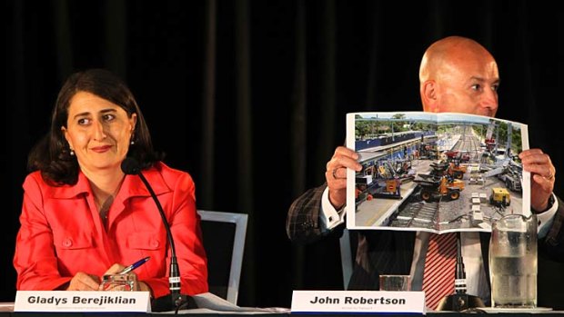 Life in the fast lane ...  Gladys Berejiklian and John Robertson at the forum last night.