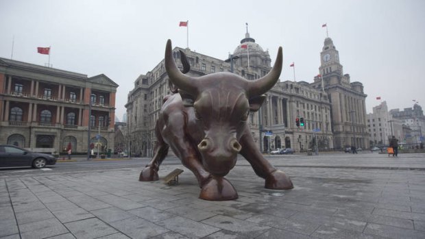 Financial power: A bull sculpture stands on the historic Bund waterfront in Shanghai.