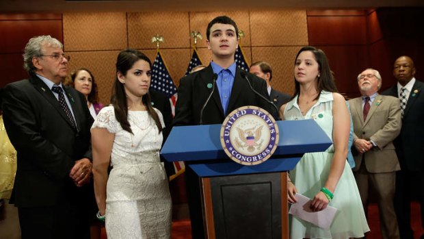 Tribute: Carlos Soto, brother of slain Sandy Hook teacher Victoria Soto, speaks on the six-month anniversary of the shooting.