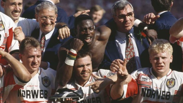 Halcyon days: Members of the Wigan team celebrate after beating Leeds 26-16 to win the Challenge Cup final at Wembley on April 30, 1994. Among the players are Dean Bell (bottom, left), Martin Offiah (centre) and Mick Cassidy (bottom right).