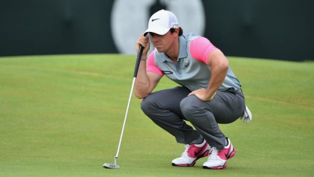 Rory McIlroy sizes up a shot on the second green on Sunday.