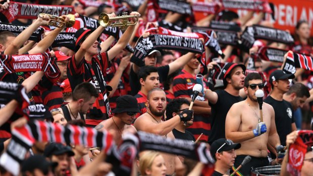 Nothing to see here, move along: Fans enjoy the atmsophere during the round four A-League match between the Western Sydney Wanderers and Perth Glory at Pirtek Stadium.