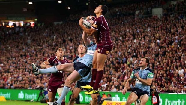 Israel Folau proves his worth to his new code with an almighty leap for the ball.