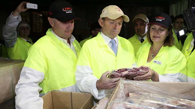Opposition Leader Tony Abbott visits a beef processing plant.