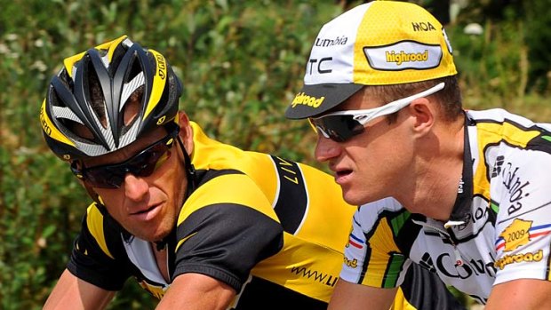Old times: Lance Armstrong (left) chats with Michael Rogers during training in 2009.