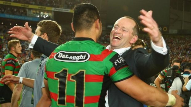True believer: Souths coach Michael Maguire embraces Ben Te'o after breaking the club's 43-year drought.