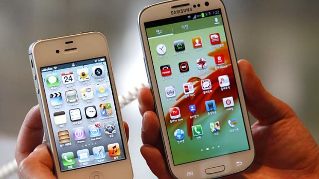 Head-to-head: Apple's iPhone 4S, left, and Samsung's Galaxy S III, which runs on Android.