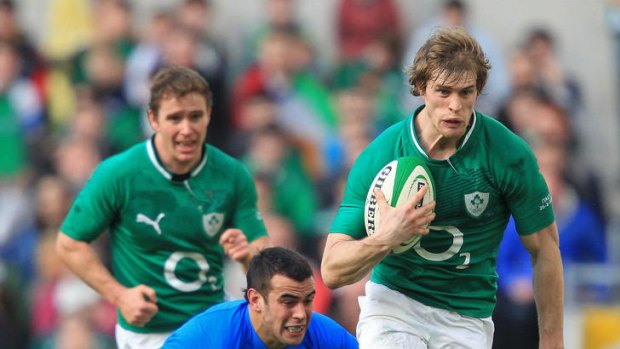 Away ... Ireland winger Andrew Trimble evades a tackle by Italy's Gonzalo Javier Canale to score Ireland's final try.