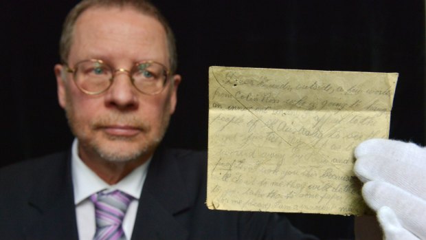 Grim reminder: Historian Kevin Morgan holds the pleading  note from Colin Ross who was hanged for a crime he didn't commit, in 1922. 