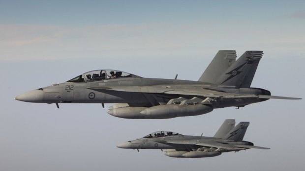 RAAF F/A-18F Super Hornets return after completing a combat mission over Iraq. 