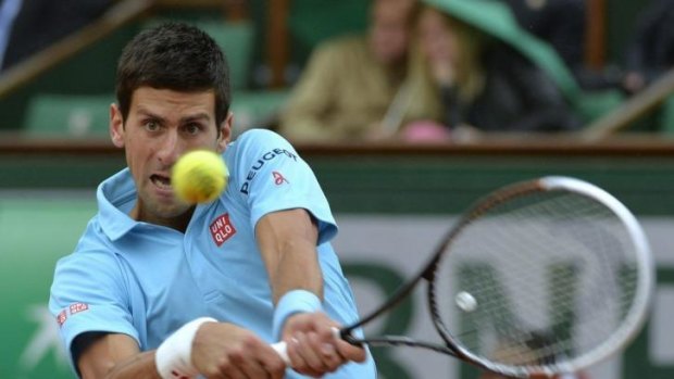 Novak Djokovic hits a return to Portugal's Joao Sousa.