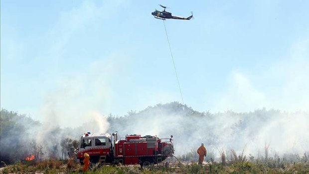 Expecting calmer conditions: Cold front brings welcome relief to firefighters.