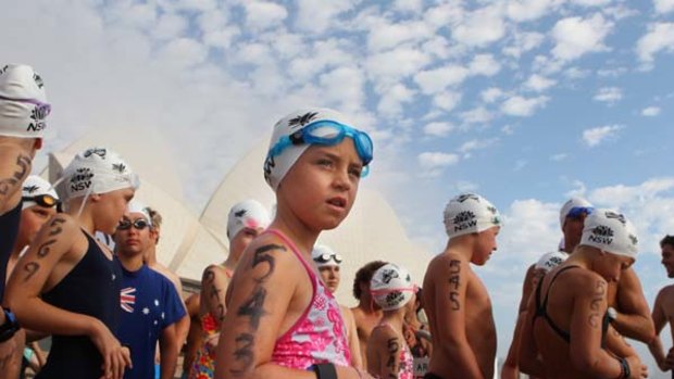 Fun for some but reminders of heartache for others ... youngsters took part in the Great Aussie ocean swim at Farm Cove in Sydney.
