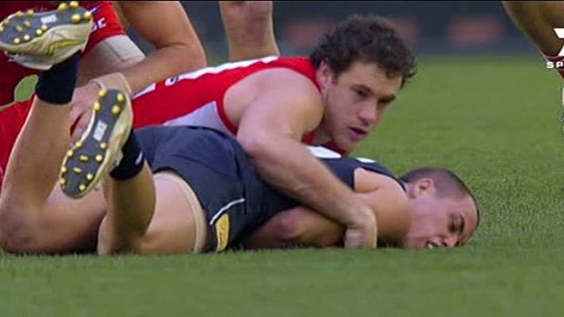 Sydney's Shane Mumford tackles Carlton's David Ellard.