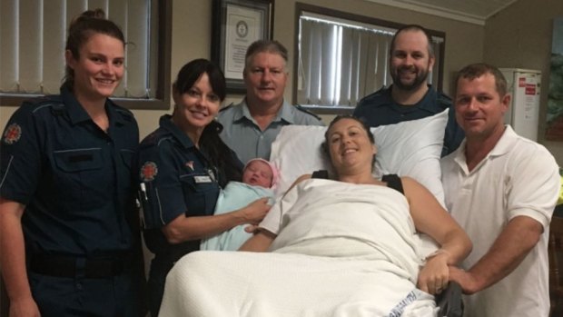 Baby Billianna with paramedia Pamela Price, mother Suzanne, dad Tim, and the Whitsunday Ambulance crew.