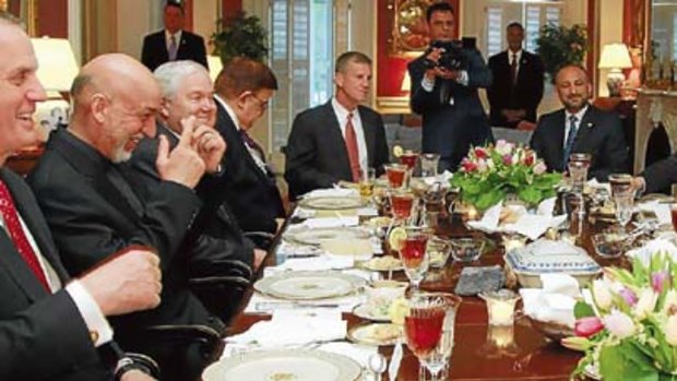 Hillary Clinton  has dinner with Hamid Karzai at Blair House in Washington.
