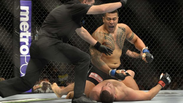 Soa Palelei of Australia knocks out Pat Barry of the US in their UFC Brisbane bout at the Brisbane Entertainment Centre.