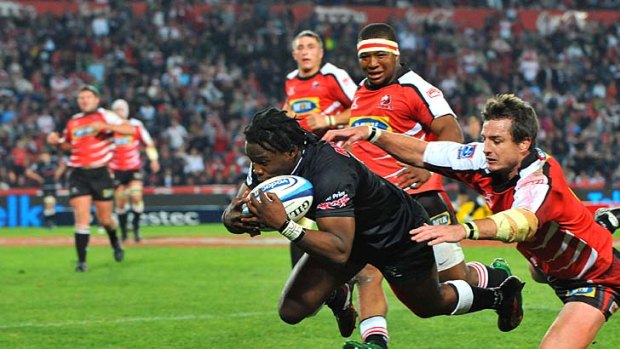 All square ...  Lwazi Mvovo pounces on a grubber kick by Patrick Lambies to earn a draw against the Lions.