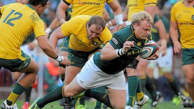Floodgate opens: Springboks hooker Adriaan Strauss  Africa dives over for the first try.