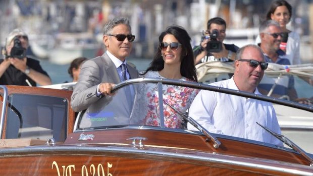 Clooney and Alamuddin on a water taxi after the big event. 