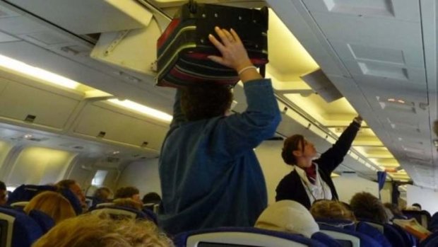 A quicker way to get passengers on a plane is to have them board based on their carry-on luggage, a study has found.