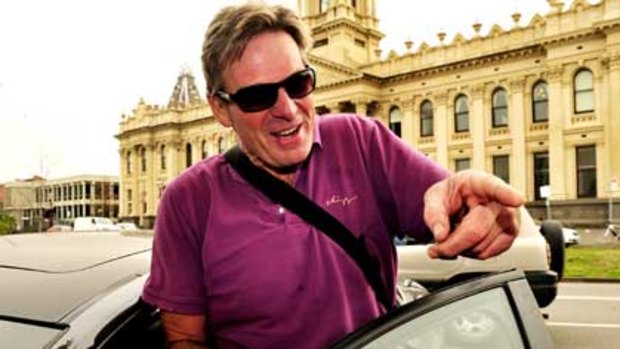 Sam Newman leaves South Melbourne police station in July last year.