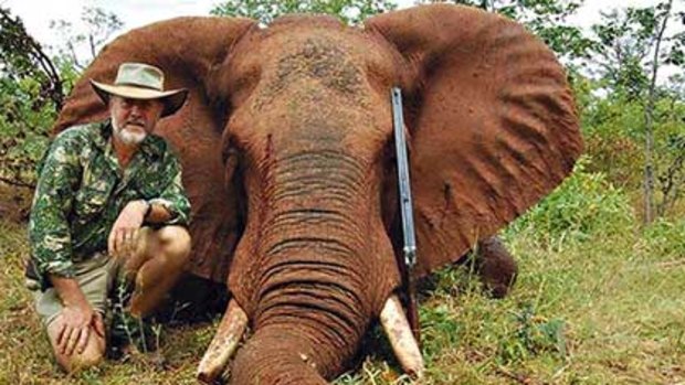 Big prize ... the chairman of the Game Council NSW, Robert Borsak, poses with one of his kills in northern Zimbabwe.