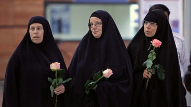 Three roses ... the mothers at Tehran airport.
