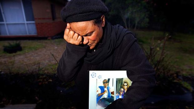 An anguished Tsehai Atomsa with a photo of her son, Obsa.