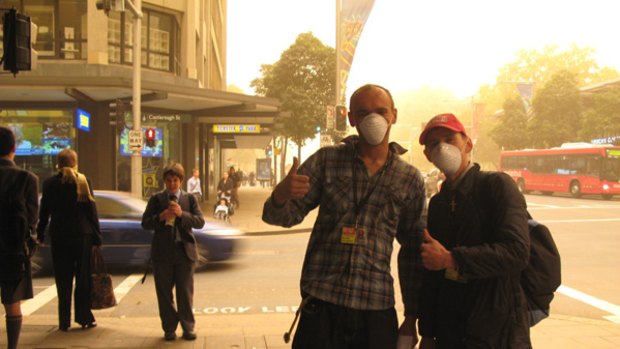 Lots of dust? Get your mask ... Sellers of the <i>Big Issue</i> magazine on Market Street in Sydney's CBD.