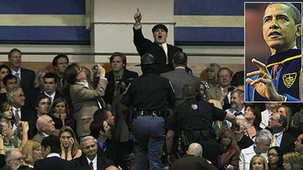 A protester is escorted out as he heckles President Barack Obama during the 2009 graduation ceremony at the University of Notre Dame.