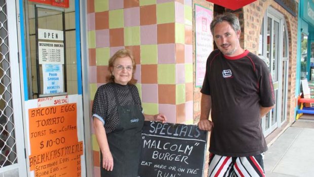 Food for thought ... cafe owners Denise and Darren Bruce with their "Malcolm burger" menu.