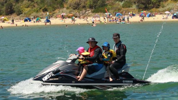 Easy riders: The Stephens family take a gentle cruise on their jet-ski at Half Moon Bay (from left) Aliarne, 3, Cameron, Hayden, 5, and Angie.