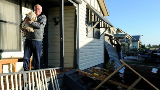 A resident surveys the damage.