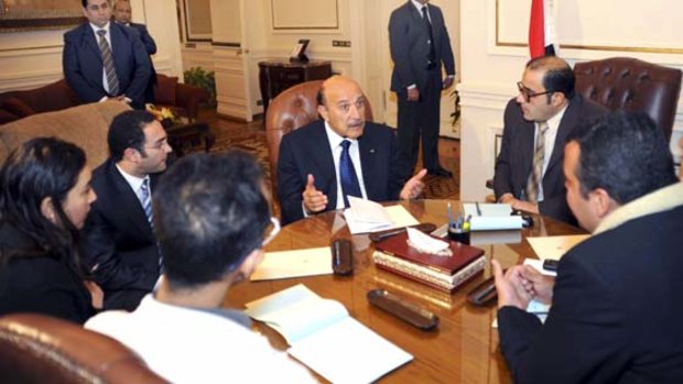Egyptian Vice-President Omar Suleiman, centre, meets with representatives of protesters.
