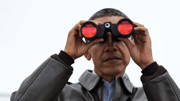 Staring into the void ... Barack Obama peers across the demilitarised zone into North Korea after arriving in Seoul for a nuclear security summit.