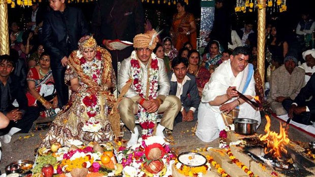 Wrestler Sushil Kumar with his bride Savi during their wedding in Delhi. The government is consider limiting the number of guests at social events, as well as the dishes that can be served.