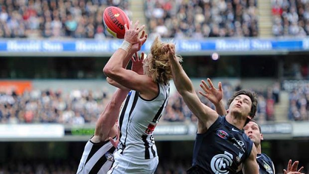 Collingwood's Dale Thomas takes a pack mark against Carlton at the MCG.