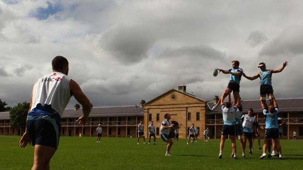 Up in the air &#8230; Rocky Elsom takes a ball during a Waratahs training session at Victoria Barracks on Wednesday. The Tahs play the Highlanders in Dunedin tomorrow.