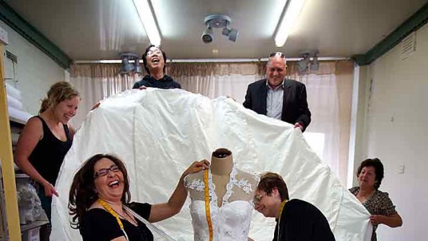 Well-trained: The Raffaele Ciuca team proudly shown off their version of the royal wedding dress.