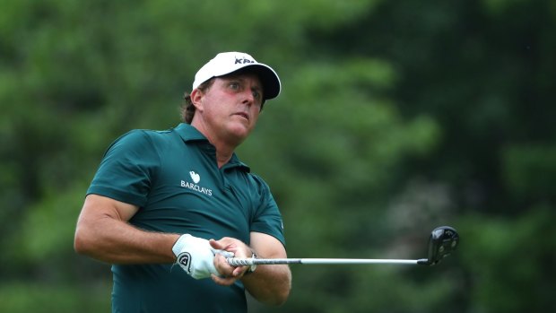 On target this time: Mickelson tees off on the 18th hole, having hit a volunteer on the head in the 15th  in Dublin, Ohio.